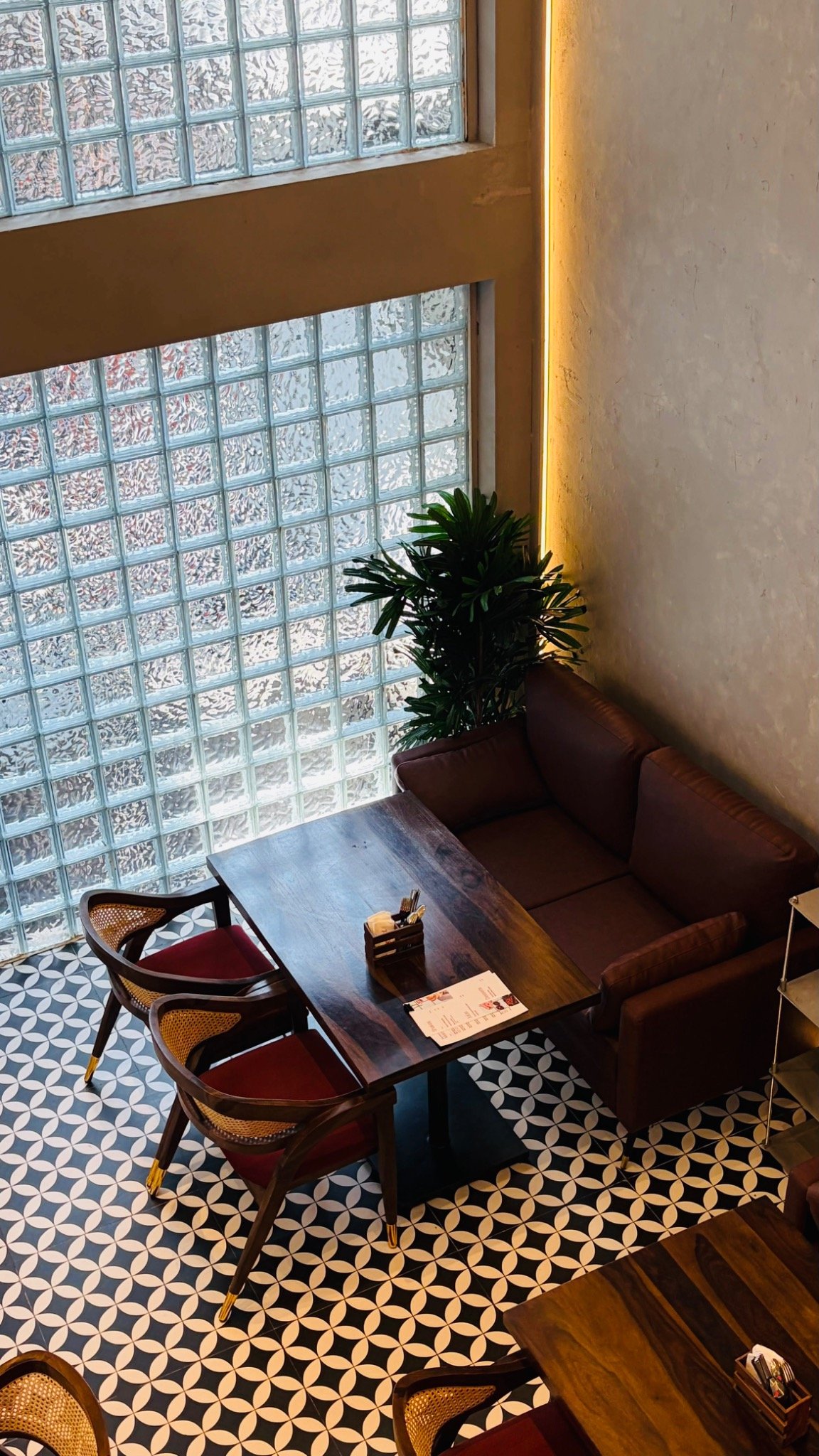Cafe sofa seating and DYKU chairs at Onefold